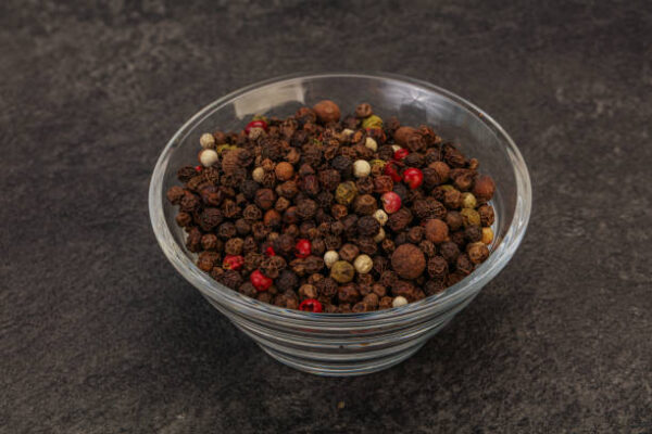 Various peppercorn heap in the bowl